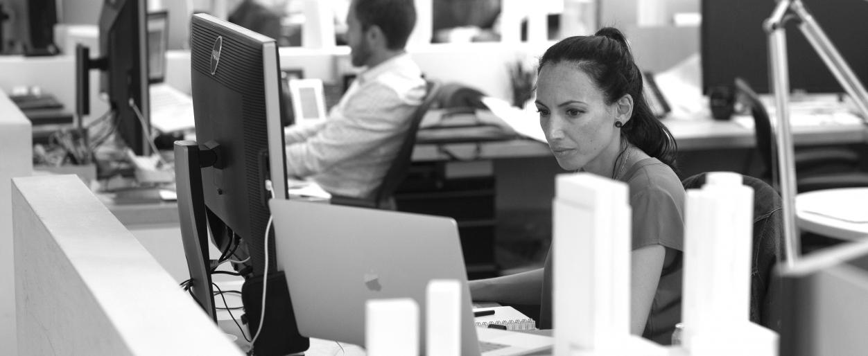 Javiera Palacio is working at her desk.