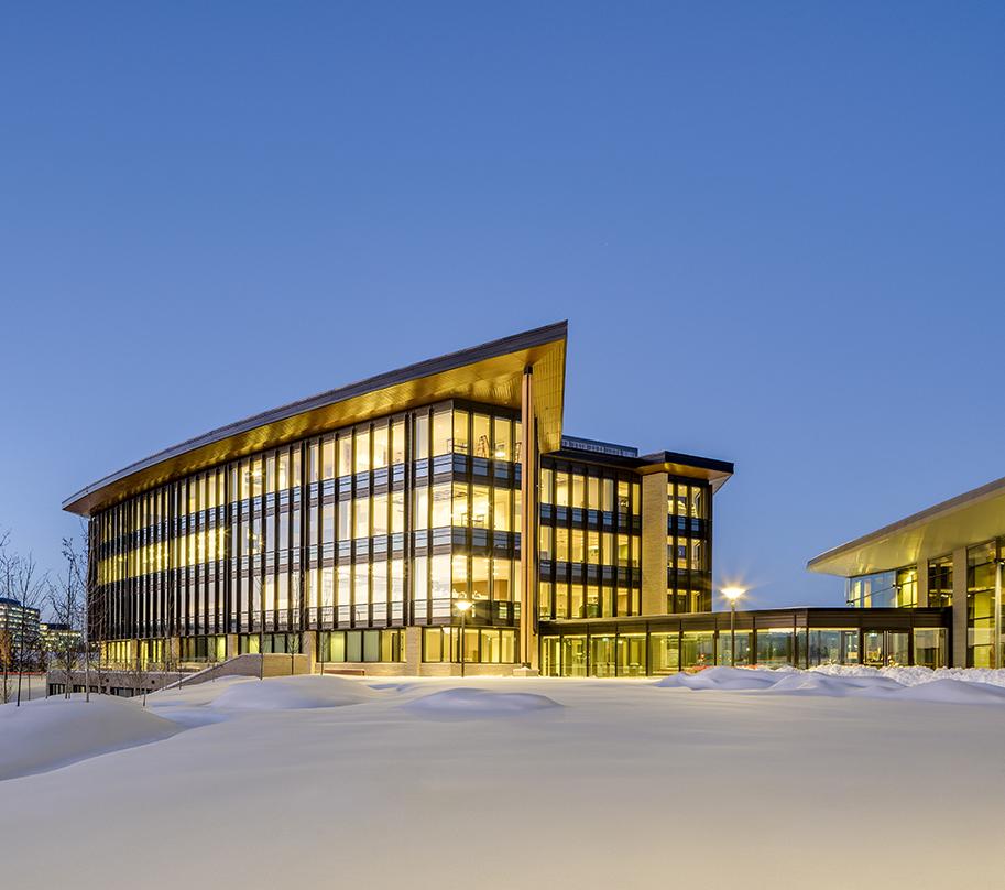 The LEED NC-Gold buildings are sited to provide panoramic views to the Rocky Mountains and the Calgary skyline and for an advantageous solar orientation. The first floor of the parkade creates a level plinth within the sloping landscape, upon which the buildings and central quad are sited.