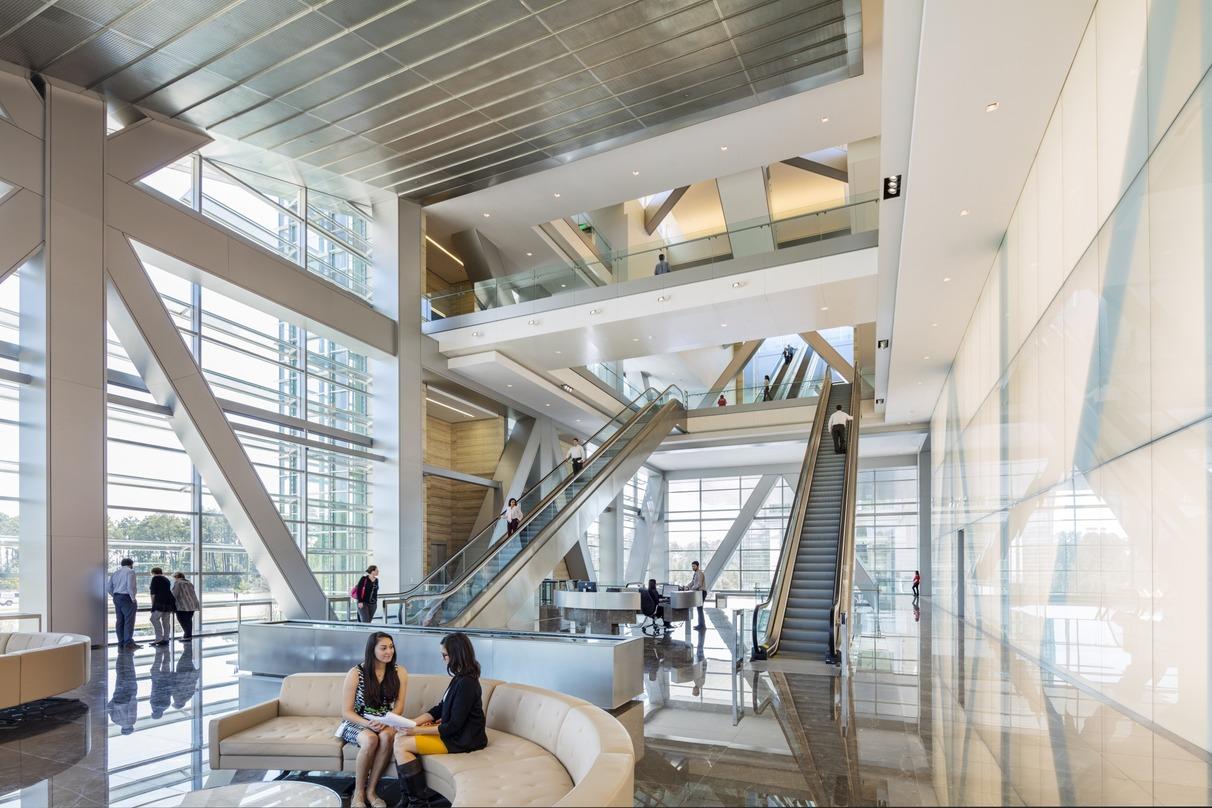 People interacting with each other inside the ExxonMobil Energy center, Houston, Texas.