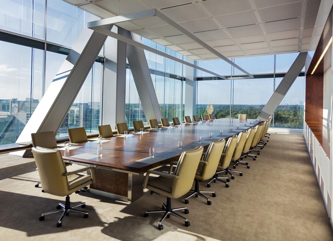 Conference room inside the ExxonMobil Energy Center with a picturesque view from the glass frame wall.