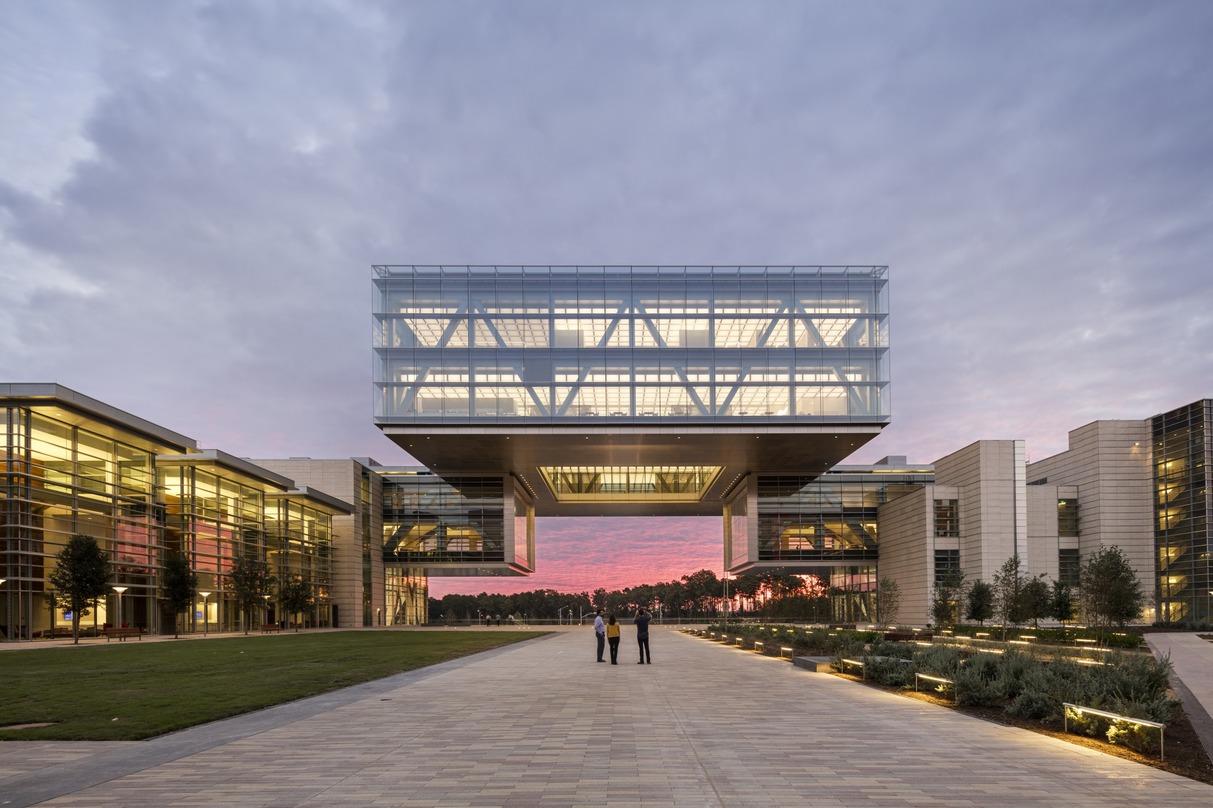 People gazing at the picturesque design of the ExxonMobil Energy Center located in Houston, Texas. 