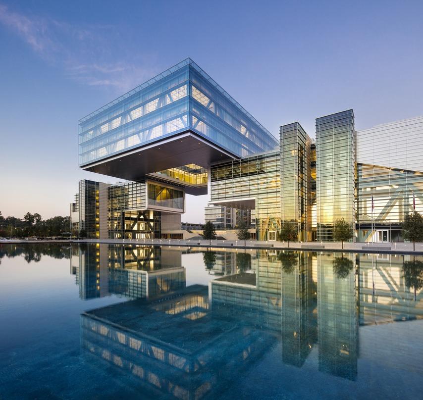 water reflecting a cantilever building design ExxonMobil Office Complex