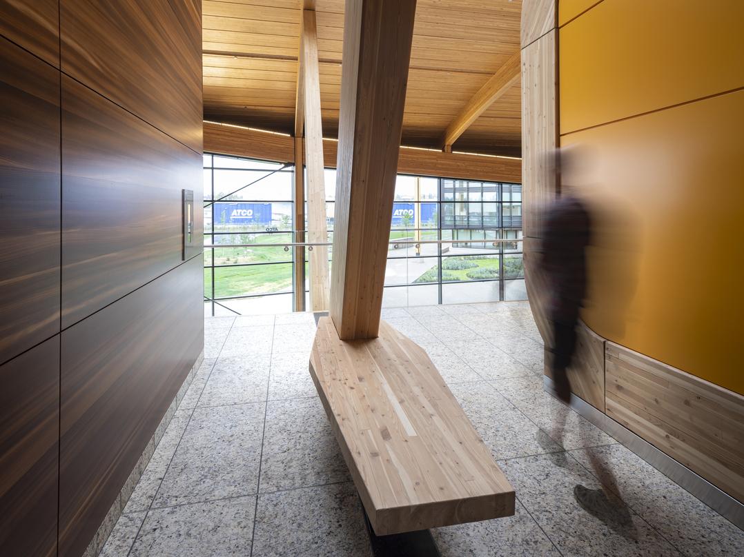 The warm wood structure signifies the heart of the campus and houses the Commons with an arched form that is derived from the hull of a wood strip canoe.