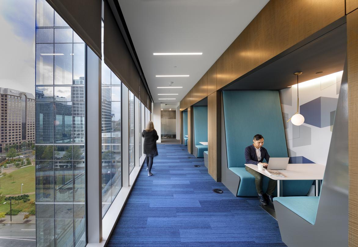 Blue-floored hallway inside the 20-storey 600 Canal Place located in Richmond, Virginia.