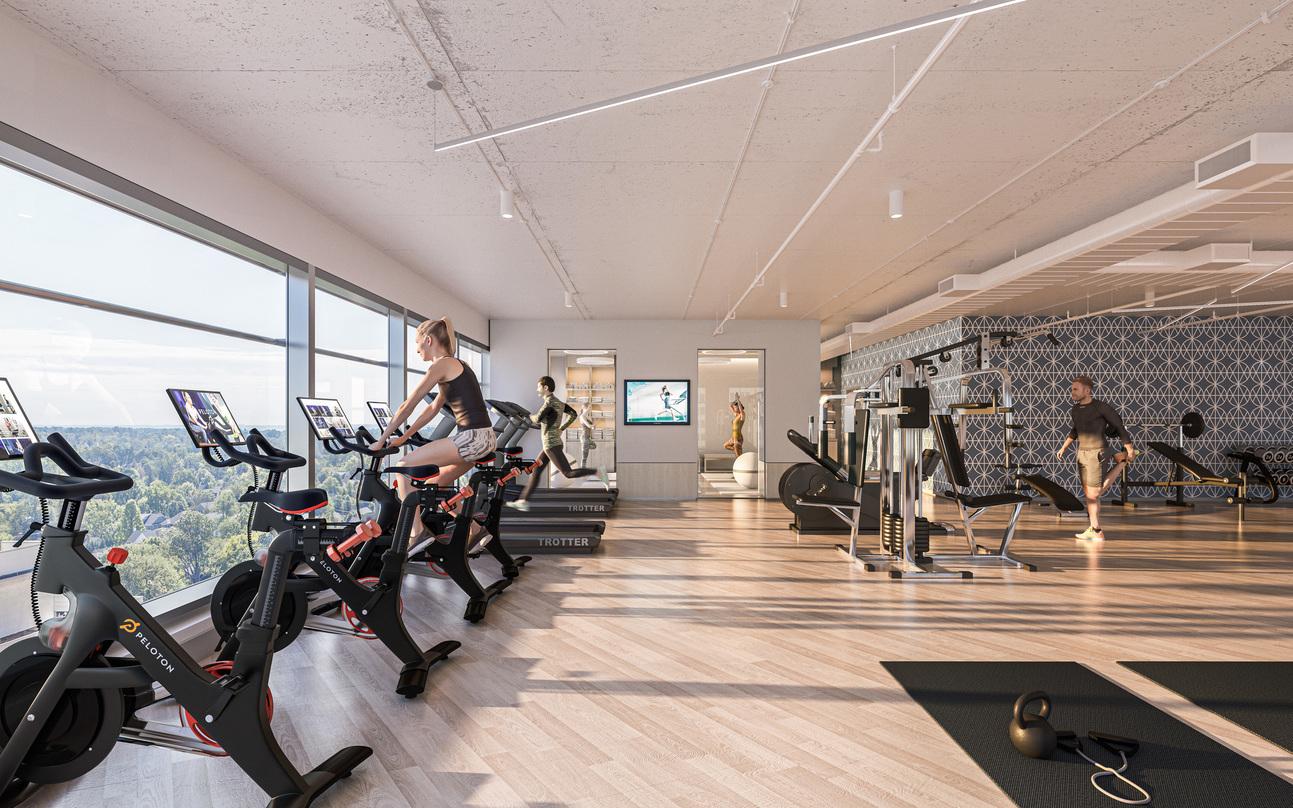 The workout room at Avocet Tower with glass frame walls.