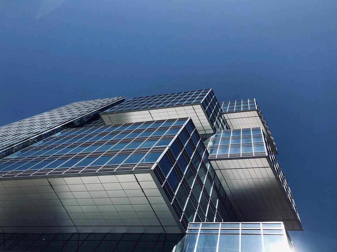 looking up at five interlocking bars create a series of cantilevers Akamai Headquarters building