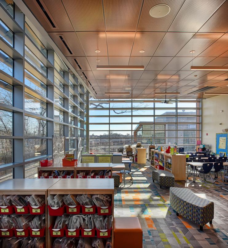 Interior designs of Barack H. Obama Magnet University school with glass frame walls in New Haven, Connecticut.