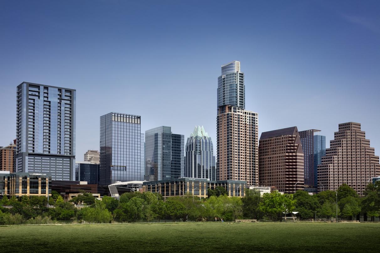 Exterior view of design proposal for 300 Colorado, premier properties in downtown Austin, situated close to a bridge.
