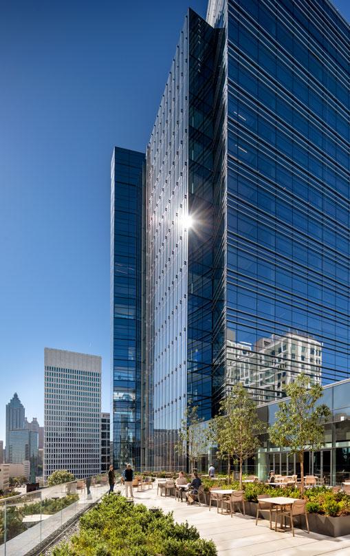 Pickard Chilton's Norfolk Southern’s(Atlanta) corporate architectural design- A professional viewing the exterior green courtyard.