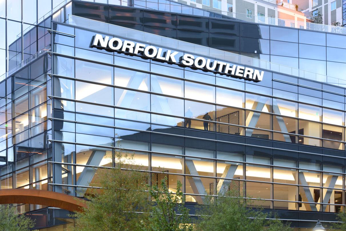 Workers looking out of the Norfolk Southern Headquarters building