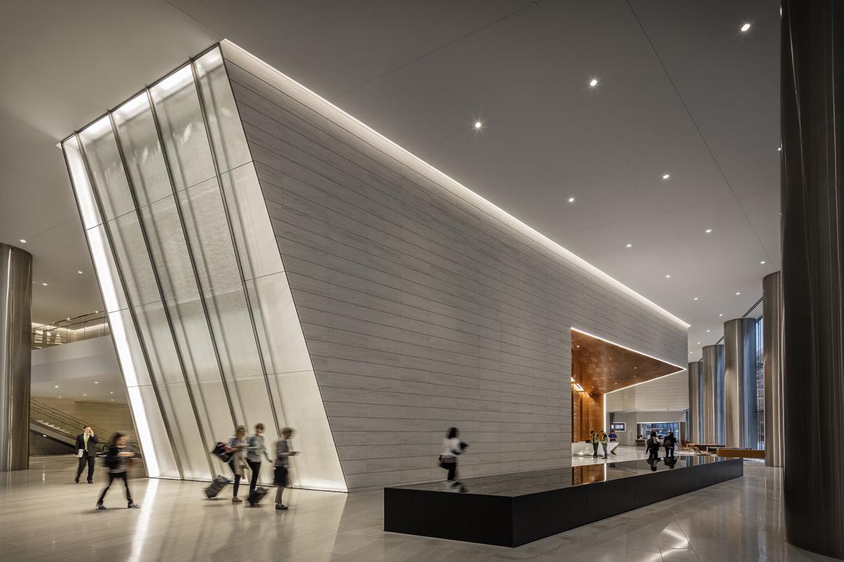 People walking inside the 609 Main, Class-A next generation office tower in Houston, Texas.