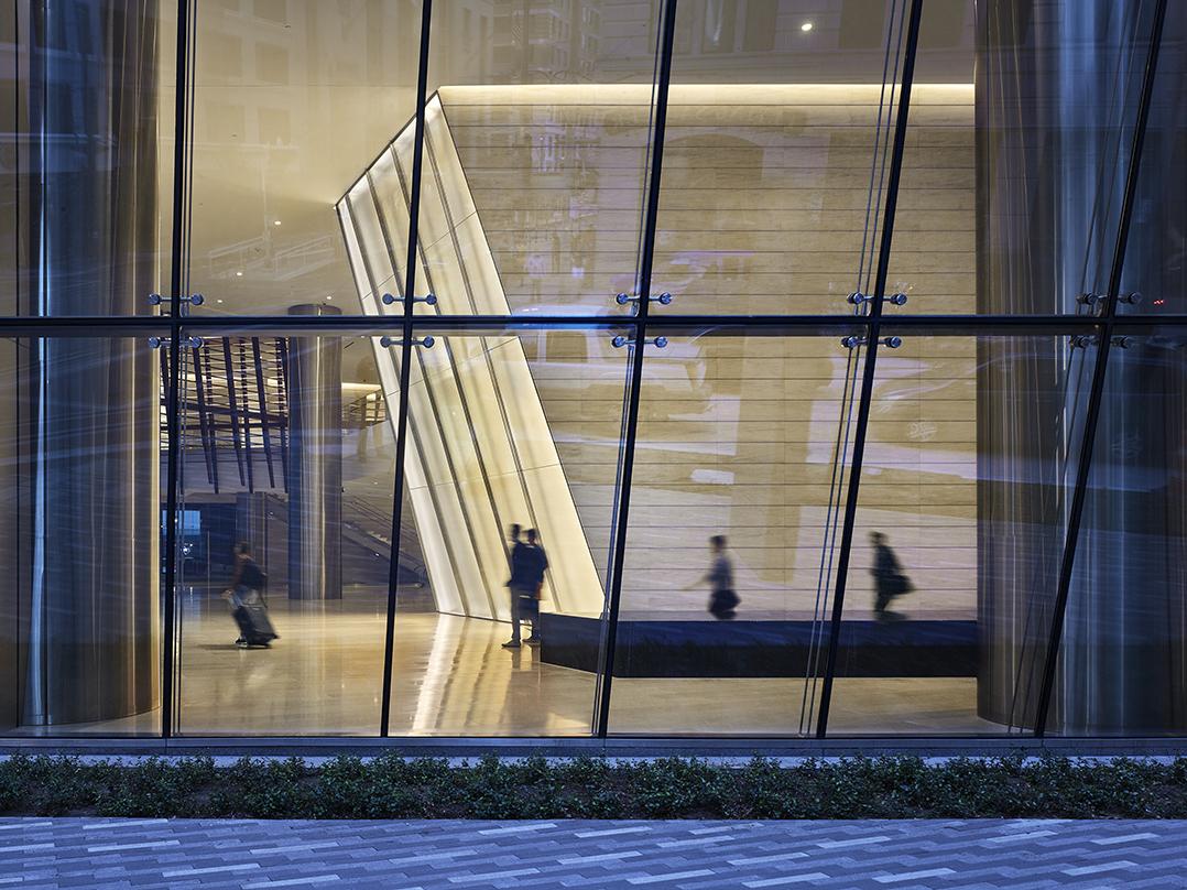 People walking inside the 609 Main, Class-A next generation office tower in Houston, Texas.