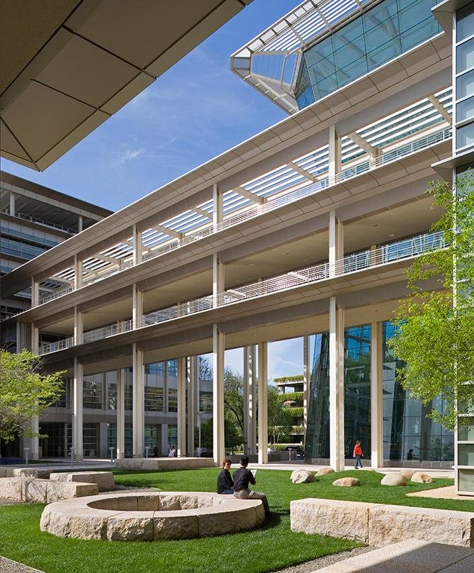 two people sitting in an atrium CalPERS Headquarters Complex