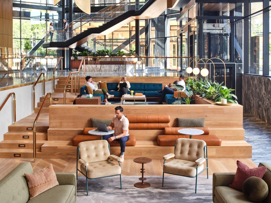 Aesthetically placed furniture and suspended roof designs inside our next-generation commercial office development design in Bellevue.