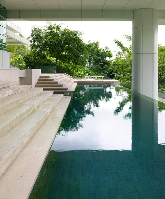 Architects designed stairs leading down to pool in a residental home Kuala Lumpur