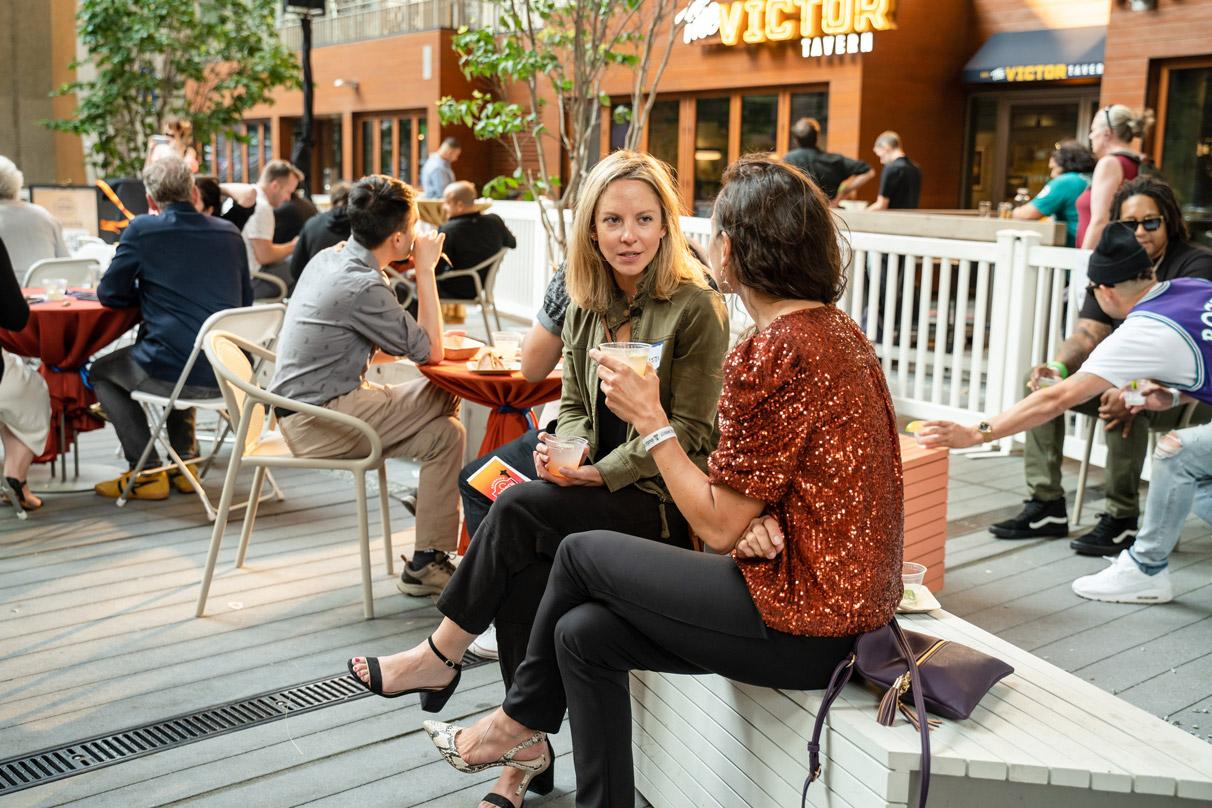 Groups gathering at the retail spaces under the canopy at the 2+U urban villiage