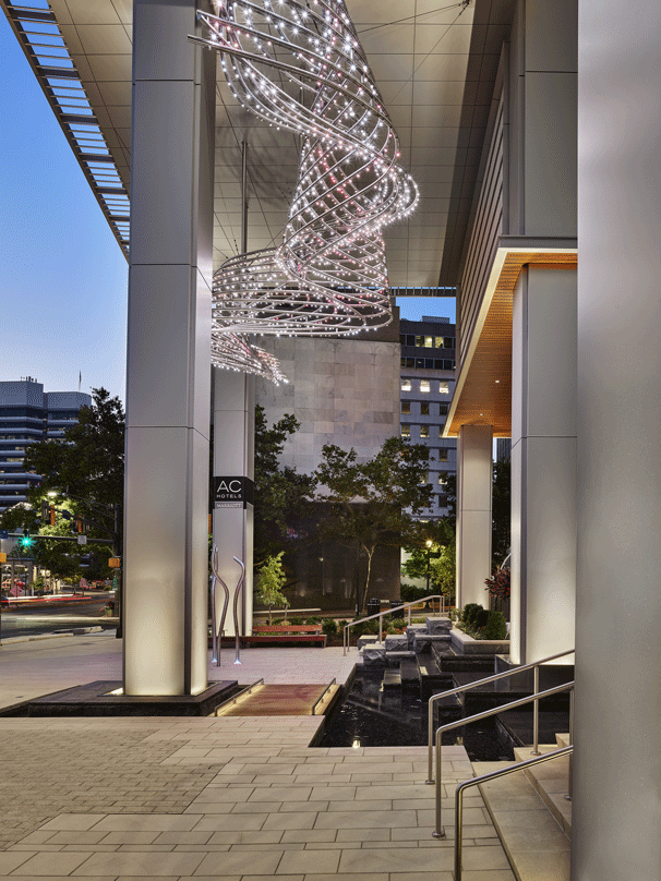 Entrance of the Avocet Tower with suspended molecular design.