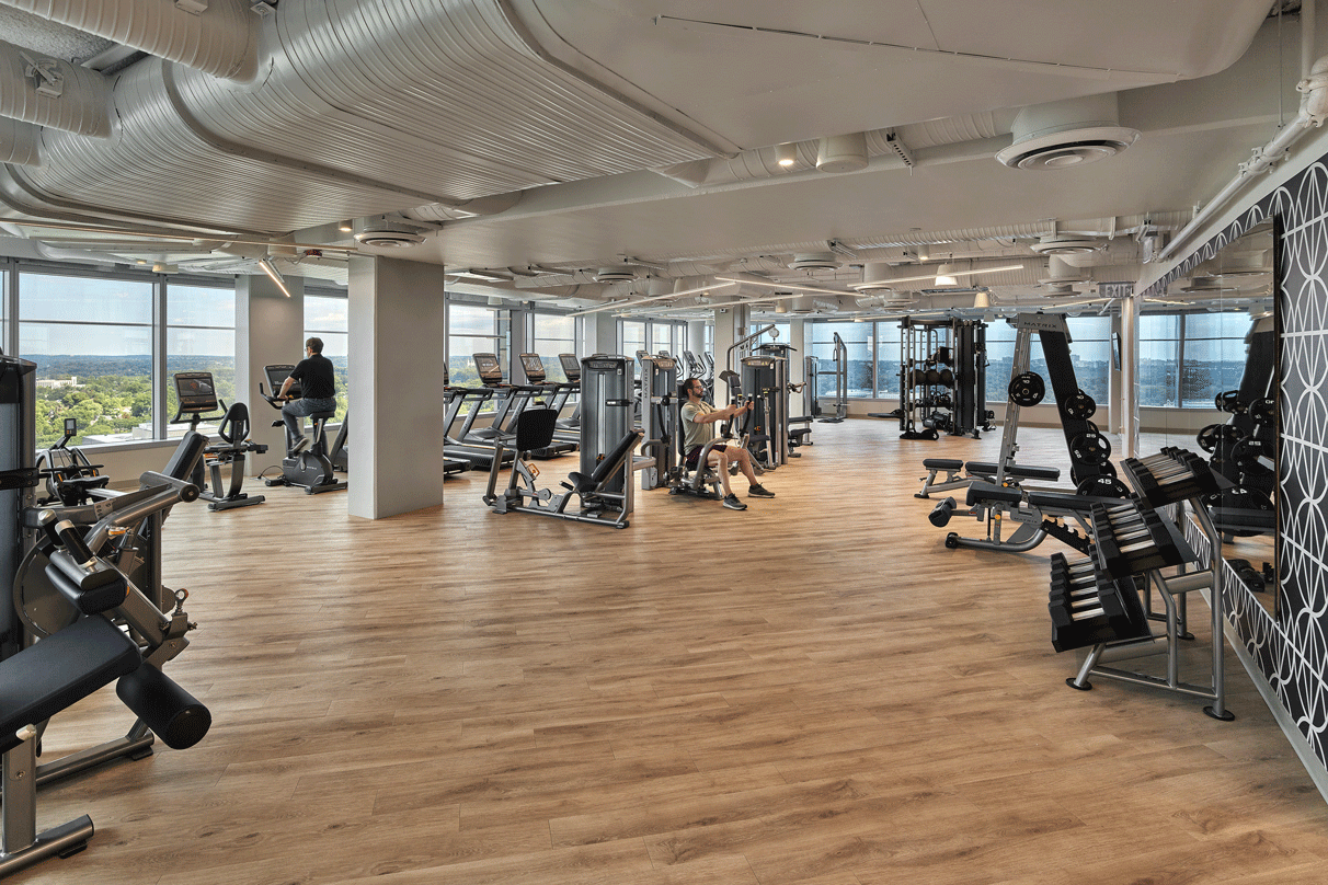 The workout room at Avocet Tower with glass frame walls.