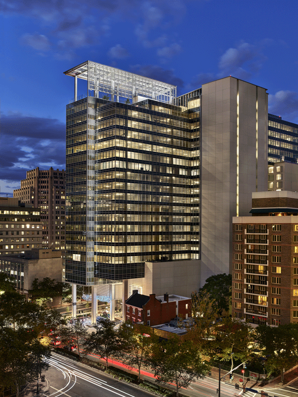 An arial view at dusk of the Avocet Tower transforming the Bethesda skyline