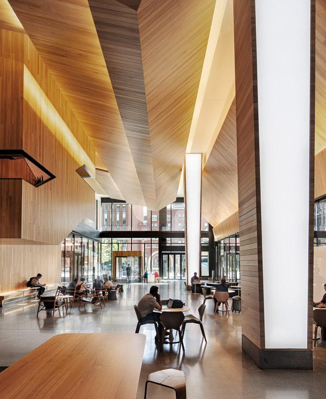 Warm wooden atrium showing the interior architecture of Google Cambridge