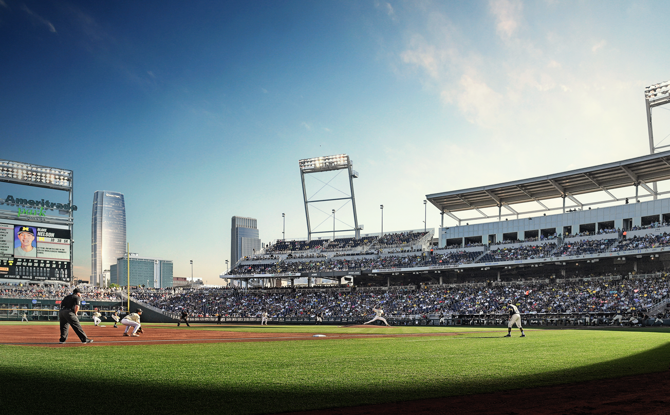 The Mutual of Omaha tower is seen from the baseball diamond while a game plays