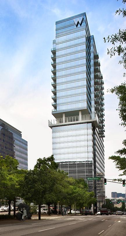 looking up the W Atlanta-Downtown and The Residences glass facade. These residences include six spectacular double-height duplex penthouses.