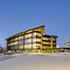 The LEED NC-Gold buildings are sited to provide panoramic views to the Rocky Mountains and the Calgary skyline and for an advantageous solar orientation. The first floor of the parkade creates a level plinth within the sloping landscape, upon which the buildings and central quad are sited.