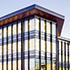 The tall, vertical wood fins and deep roof eaves are tuned to maximize views while optimizing the natural light into the office buildings. The textured fins resemble the tall prairie grasses found throughout the plains.