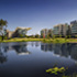 buildings reflecting off a pond at the ExxonMobil Wellness Center