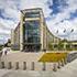 pedestrian view of the five storey Minnesota Senate Building with glass facades located in St. Paul, Minnesota.