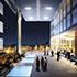 an architectural rendering of an open lobby looking out at the nightime city from the Abu Dhabi Luxury Hotel
