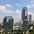 a mid arial view with building reflecting off the glass facade of W Atlanta-Downtown and The Residences building