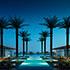 an architectural rendering at sundown palm trees and poolside Abu Dhabi Luxury Hotel