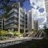 An open area with water fountains along the length of the outside walkway. ExxonMobil Office Complex, Houston, TX