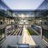 People walking in the symmetrically designed central atrium at the ExxonMobil Energy Center, Houston, Texas.