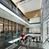 a person walking up the stairs and a view inside ExxonMobil Wellness Center