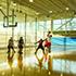 people playing basketball in the gym of the ExxonMobil Wellness Center