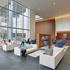 People sitting inside the glass frame walls of the 20-storey 600 Canal Place located in Richmond, Virginia.