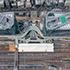 Aerial view of the Takanawa Gateway City construction site, showing two skyscrapers, cranes, and various construction materials and structures.
