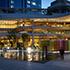 The public plaza of Takanawa Gateway City seen at nighttime illuminated.