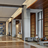 Hospitality lobby with stone wall feature at Avocet Tower and AC Hotel