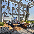 The upper level deck of the Avocet Tower, with a leisure area and adequate greenery.