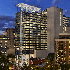 An arial view at dusk of the Avocet Tower transforming the Bethesda skyline