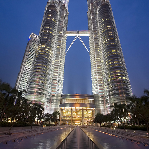 The exterior view of expansive glass curtain wall in Petronas Towers’ concert hall, located Kuala Lumpur, Malaysia.