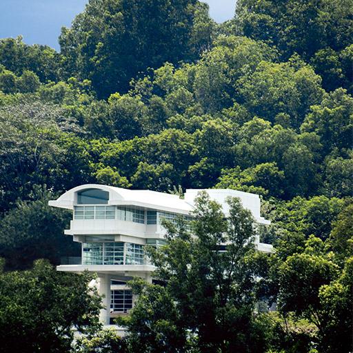 The exterior of a private residence in Kuala Lumpur, Malaysia with dramatic views set in a tropical region.