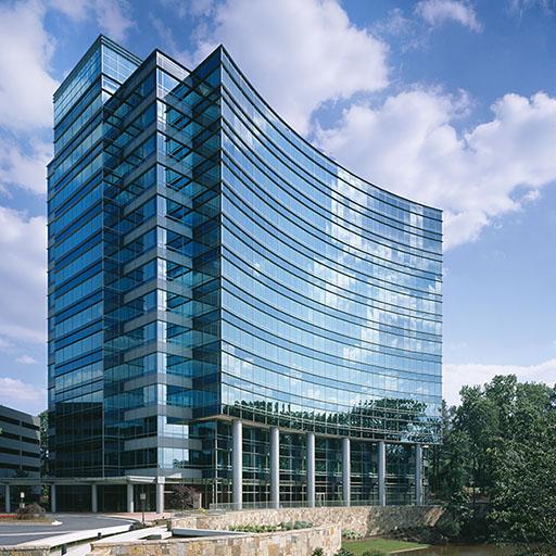 Glass framed walls of Oracle’s headquarters at One Glenlake built with energy efficient materials to minimize the heat.
