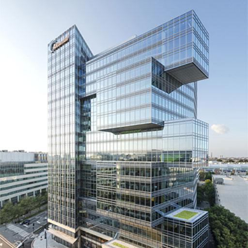 The exterior design of Akamai Headquarters located in Cambridge, Massachusetts with glass framed walls.