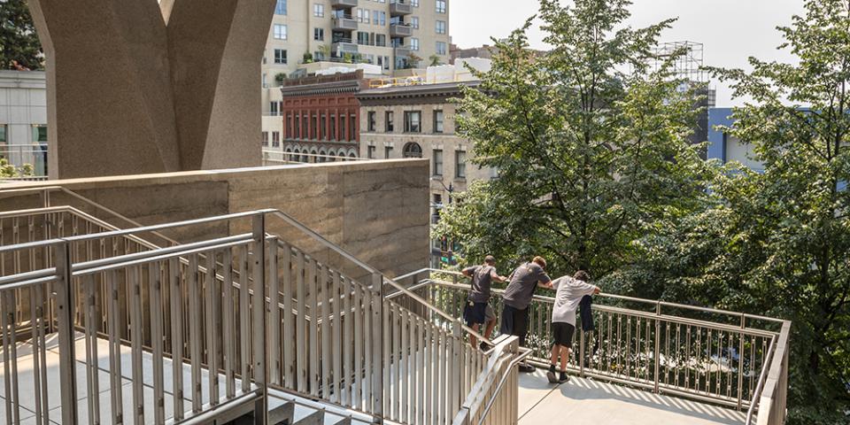 Children play on the stairs at 2+U in Seattle, Washington. 