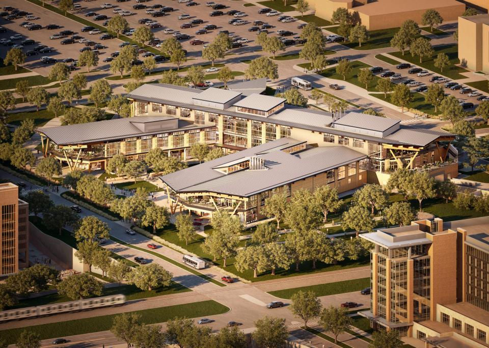 Aerial view of Texas A&M’s Aplin Center, a modern three-story, 211,724 sq ft mass-timber building surrounded by trees and green space.