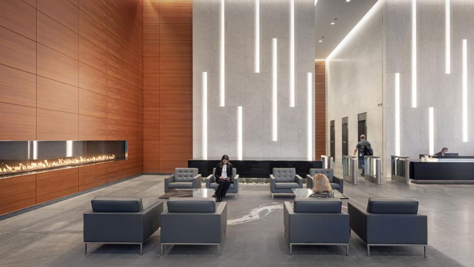 Business women sitting in Thomas F. Farrell II Building lobby